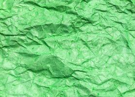 Pattern of green crumpled paper texture background. photo