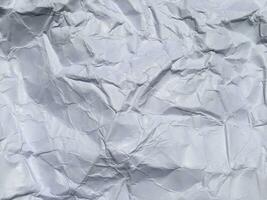 Top view of white crumpled paper texture background. Copy space for design and artwork photo