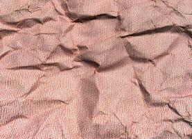 hermoso patrón de fondo de textura de papel arrugado rojo. foto
