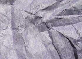 fondo de textura de papel arrugado púrpura moderno abstracto. foto