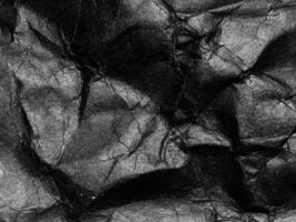 Black crumpled paper texture background. Copy space for design and artwork photo
