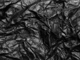 Black crumpled paper texture background. Copy space for design and artwork photo