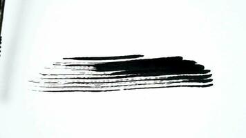 black line brush strokes for footage elements overlay. animated hand scraping mascara with black ink for lower third and transition. video