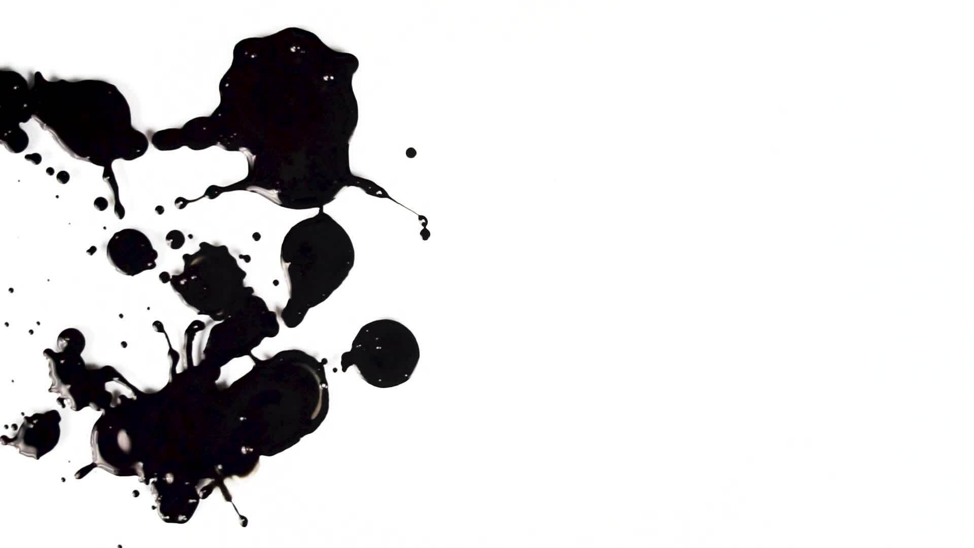 Drop black paint animation on the isolated white background. Abstract
