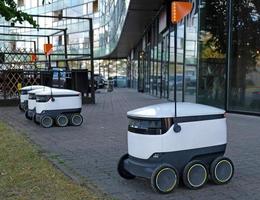 Autonomous delivery robot on Tallinn, Estonia. Estonian company developing autonomous delivery vehicles. Concept of future, technology, unmanned courier robot. photo