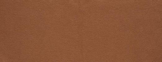 Banner with texture of smooth knitted red brown sweater with pattern. Top view, close-up. Handmade knitting wool or cotton fabric texture. Background of knitting patterns. photo