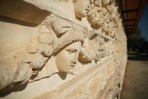 Ancient Mask Reliefs in Aphrodisias Ancient City in Aydin, Turkiye photo