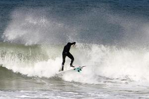 Surfing on high waves on the Mediterranean Sea in northern Israel. photo