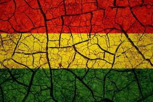 Dry soil pattern on the flag of Bolivia. Country with drought concept. Water problem. Dry cracked earth country. photo