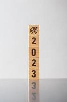 2023 block with dartboard sign. Business Goal, Target, Resolution, strategy, plan, Action motivation, mission, thinking, and New Year start concepts photo