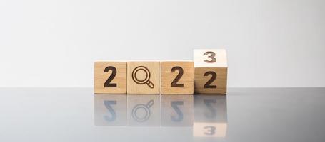 2023 block with magnifying glass icon. SEO, Search Engine Optimization, hiring , Advertising, Idea, Strategy, marketing, Keyword, Content and New Year start concepts photo