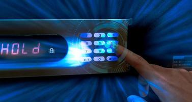 Finger pressing password code on safe box to open metal safe in hotel. Cyber security and data protection concept. Business technology privacy and personal information policy concept. Wealth protect. photo