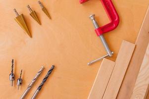 Flat lay of set of tools for concstruction works and home maintenance on wooden background. Top view. photo