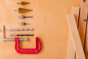 Flat lay of set of tools for concstruction works and home maintenance on wooden background. Top view. photo