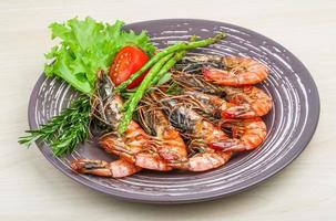 Grilled prawns on the plate and white background photo