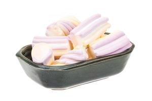 Marshmallow in a bowl on white background photo