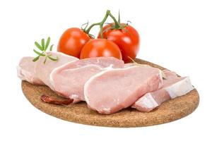 Pork steak on wooden board and white background photo