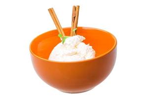 Cottage cheese in a bowl on white background photo