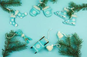 New Year's Christmas blue background with spruce branches and decorative wooden and knitted toys.view from above. a copy of the space. photo