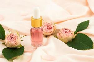 moisturizing fluid oil for the face with an extract of rose petals for facial skin care. the concept of natural self-care. photo
