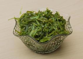 Chuka salad in a bowl on wooden background photo