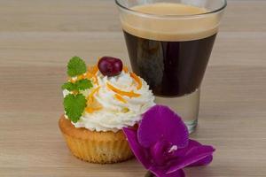 Cupcake on wooden background photo