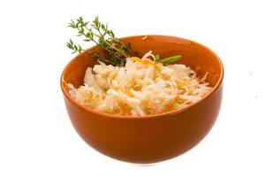 Fermented Cabbage in a bowl on white background photo