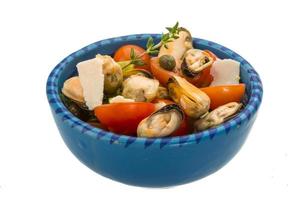 Mussells salad in a bowl on white background photo