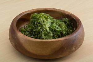 Chuka salad in a bowl on wooden background photo