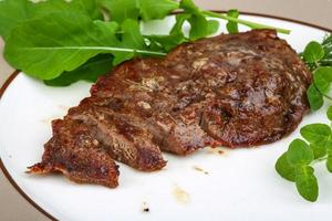 Roasted beef on the plate photo