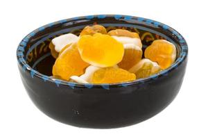 Jelly-candy in a bowl on white background photo