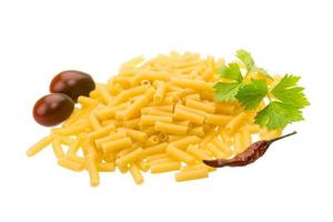 Raw macaroni on white background photo