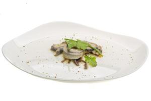 Herring fillet on the plate and white background photo