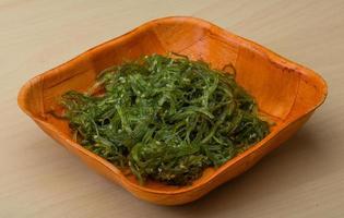 Chuka salad in a bowl on wooden background photo