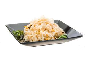 Fermented cabbage on the plate and white background photo