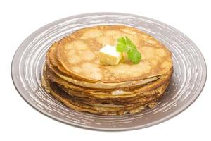 Russian pancakes on the plate and white background photo