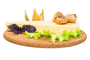 Parmesan cheese on wooden board and white background photo