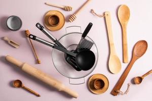 modern kitchen background. a variety of kitchen utensils on a light pastel background. top view. flat lay. photo