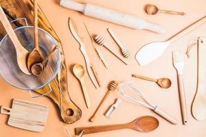 top view of various kitchen utensils laid out on a light background. modern kitchen background. flat lay. photo