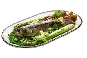 Grilled Herring on the plate and white background photo
