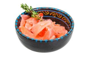 Ginger in a bowl on white background photo