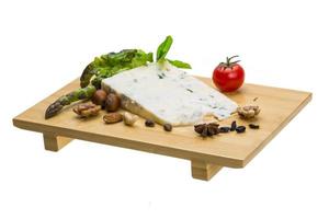 Gotgonzola on wooden board and white background photo