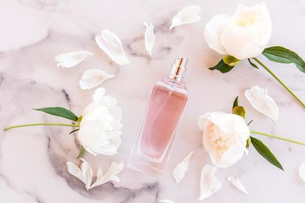 Natural Peony Essential Oil In A Glass Bottle Splash With Pink Flowers On  White Background, Organic Fresh Extracts Arom , AI Generative Stock Photo,  Picture and Royalty Free Image. Image 201340073.