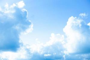 White clouds with blue sky Background On a bright day with copy space for text or banner for website photo