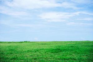 Beautiful landscape of Green field and white clouds copy space for text or design photo