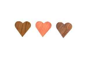Three wooden heart shape isolated on white background. Clipping path for design photo