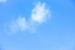 White clouds with blue sky Background On a bright day with copy space for text or banner for website photo