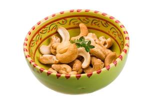 Cashew in a bowl on white background photo