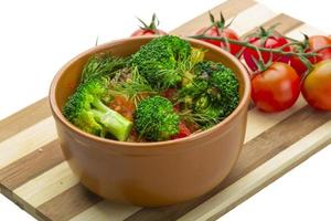 Boiled Brokoli in a bowl on white background photo