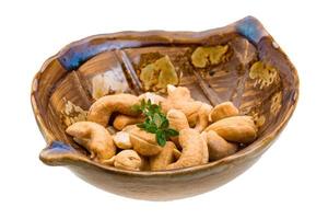 Cashew in a bowl on white background photo